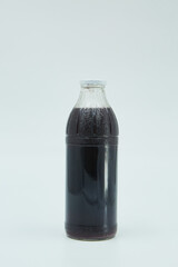 Canned black sauce in a glass bottle. Home canning. Long-term food