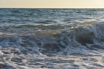 waves on the sea and yellow sky