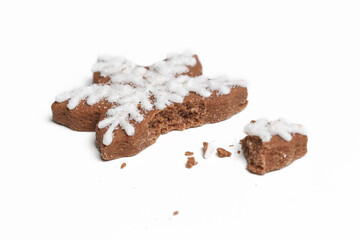 Broken snowflake gingerbread cookie isolated on white background.
