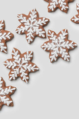 Star shaped gingerbread cookies on white background.