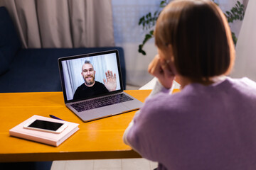 Fototapeta na wymiar Woman at home facetime video call her friends husband boyfriend, chatting online from laptop, social distance 
