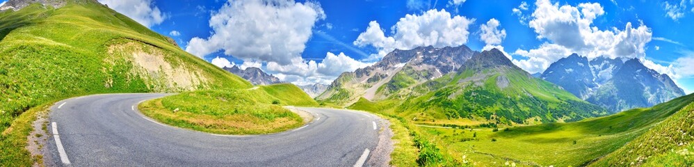 Fototapeta na wymiar View of a road in summer Alps