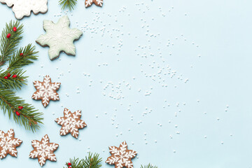 Star shaped gingerbread cookies on light blue wintery background.