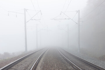 Railroad tracks stretching into the misty distance. The path into fog and uncertainty.