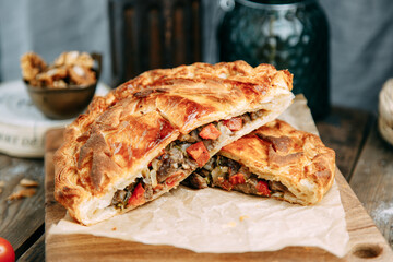 Steak pie with meat and vegetables. Puff pastry pie national cuisine.