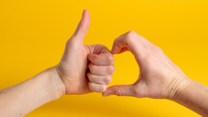 Friendzone hand sign on yellow background. Friend zone symbol. Friendzoned hands shape