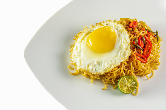 fried noodle with fride egg on the plate