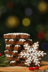 Fototapeta na wymiar Gingerbread cookies in festive Christmas arrangement with bokeh lights in background. 