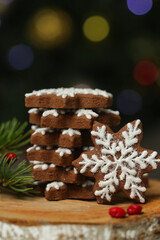 Fototapeta na wymiar Gingerbread cookies in festive Christmas arrangement with bokeh lights in background. 