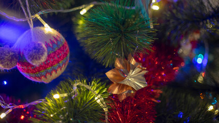 Obraz na płótnie Canvas Christmas background. Spruce branches, light garlands and Christmas toys