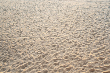 Tropical sand texture pattern, sandy beach texture background top view with copy space in summer day with Sunset light or sunrise light on beach