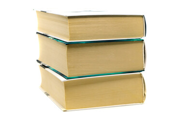 Stack of three thick books isolated on white background. Paper dictionaries, encyclopedias and reference books. Concept: reading and literature, university studies.