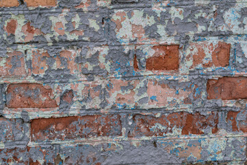 Old brick wall for a backdrop. Peeling paint.