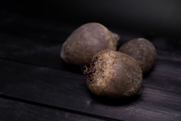 Ripe beets on wooden background