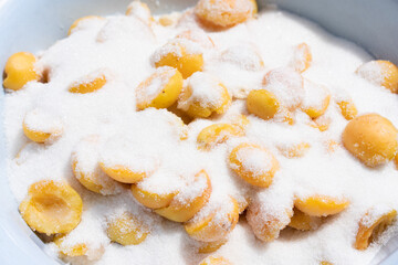 Apricots covered with sugar for making jam