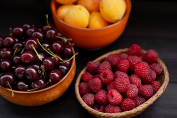 Fruits and berries on a wooden background