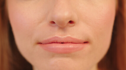 Lips of woman with no lipstic, close up. High quality photo