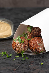 Picnic food in Eco-friendly cardboard disposable dishes. dark stone surface. Top view. Copy space