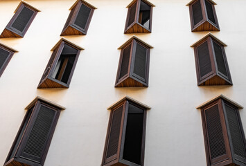 Fototapeta na wymiar wooden windows in a white facade