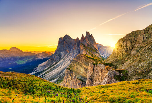 Amazing sunrise of Seceda peak with sun flare. Trentino Alto Adige, Dolomites Alps, South Tyrol, Italy, Europe