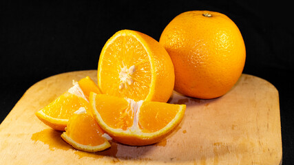 sliced orange on a wooden background