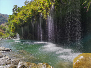 waterfall flowing in nature, cascade, cascade between rocks. Hakkari in Turkey
