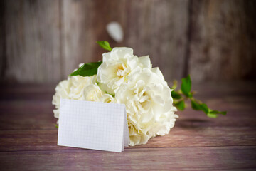 bouquet of beautiful white roses on table