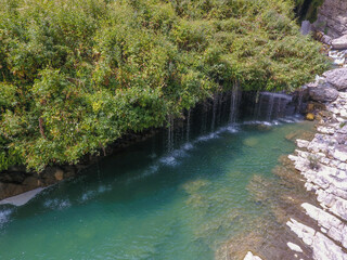 waterfall flowing in nature, cascade, cascade between rocks. Hakkari in Turkey

