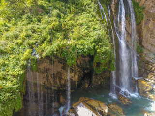 waterfall flowing in nature, cascade, cascade between rocks. Hakkari in Turkey
