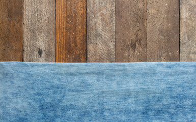 blue jeans on wooden surface background