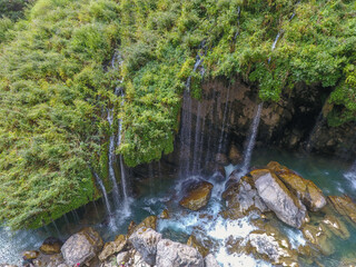 waterfall flowing in nature, cascade, cascade between rocks. Hakkari in Turkey
