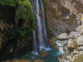 waterfall flowing in nature, cascade, cascade between rocks. Hakkari in Turkey
