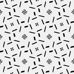 seamless background of black and white repeating patterns.
