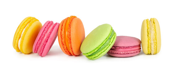 Colorful french macaroons in row isolated on white