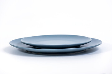 Navy Blue Dish set - Large and small plates isolated on white background side view, selective focus