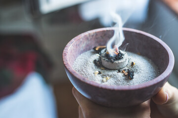 Traditional esoteric incense ritual at New Year and Christmas, smoke for cleaning the house