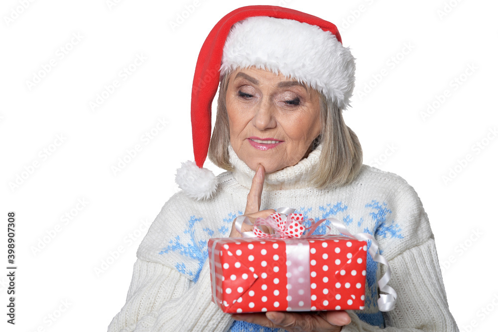 Poster Portrait of smiling senior woman in Santa hat posing