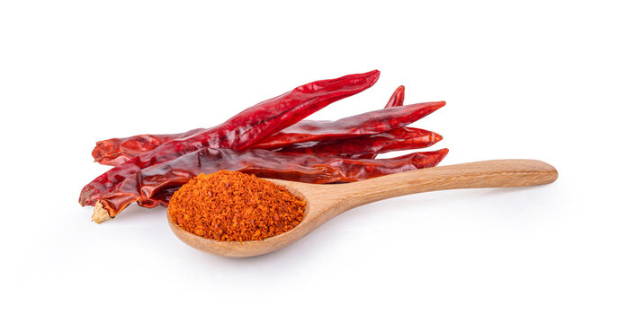 Chilli powder  and  dried red pepper on white background