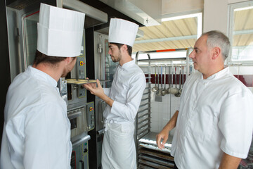 Obraz premium team of chefs working in a commercial kitchen