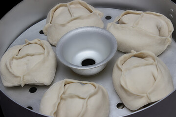 Delicious Manty, posture, khinkali is prepared in a special pot - mantoverde. dishes of Asian, Buryat, and Georgian cuisine. Cooking homemade manta rays