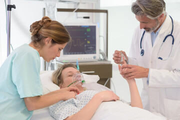 Obraz premium patient with oxygen mask lying on bed