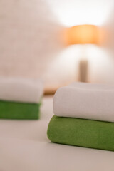 Stack towel set on bed in modern bedroom at hotel