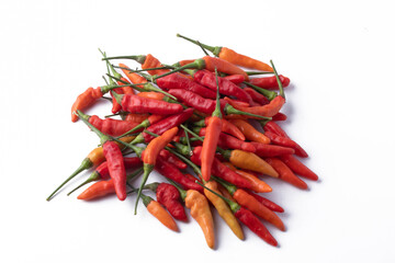 Red yellow chili peppers on white background
