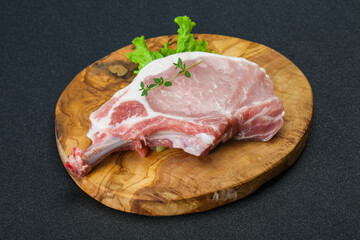 Raw pork bone steak over wooden