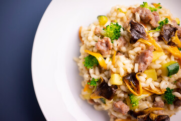 Risotto with vegetables, mushrooms and cheese. Traditional italian recipe. 