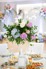 Fototapeta na wymiar Wedding table decorated with flowers