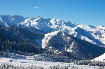 Fototapeta na wymiar Beautiful mountain winter landscape. Snowy landscape in the mountains of Kazakhstan.