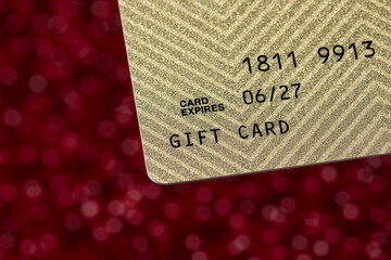 Closeup of gift card. Concept of holiday gift idea, consumer spending, and online shopping