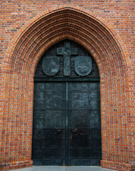 The richly decorated main gate of St. John's Archcathedral in the Warsaw Old Town