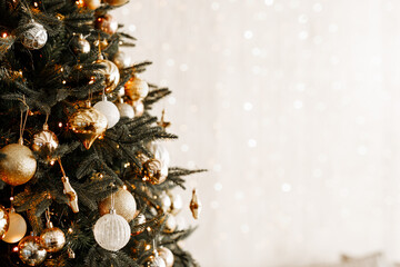 Close up of balls on christmas tree. Bokeh garlands in the background. New Year concept.